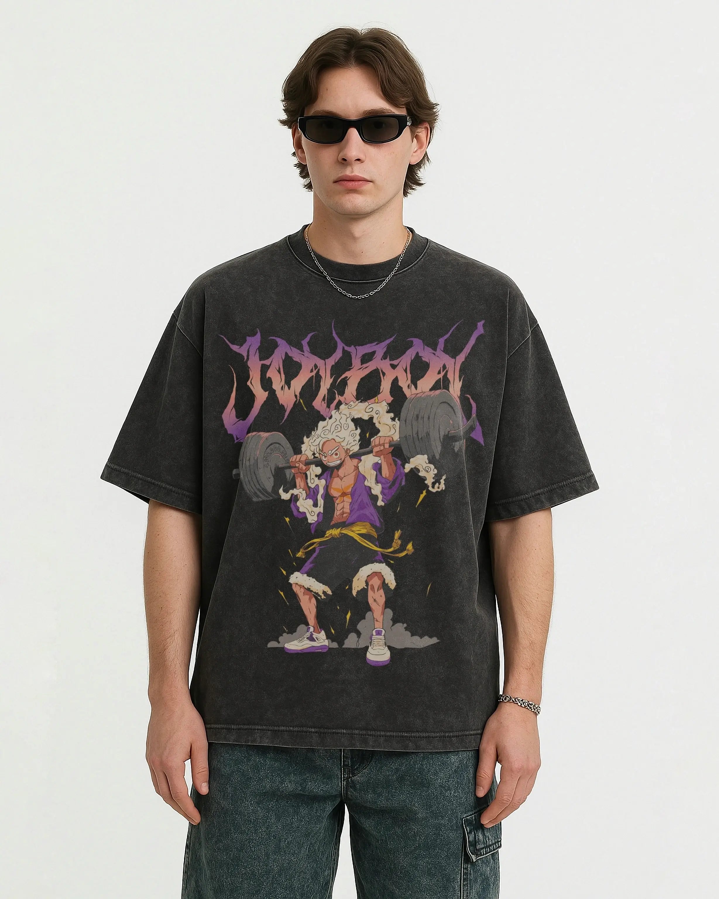 model wearing a acid wash oversized t-shirt with luffy one piece graphic design on a white background