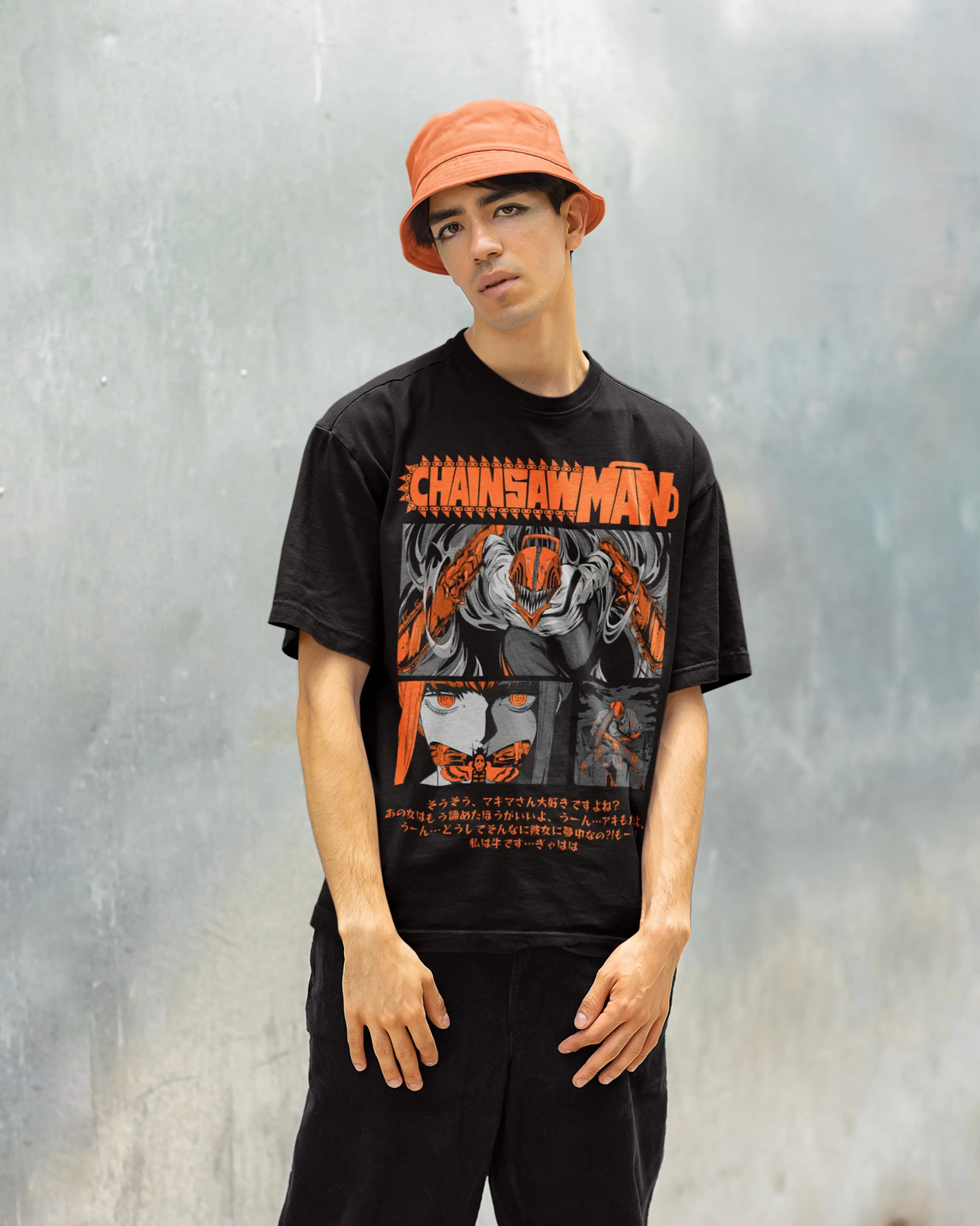 model wearing a black 'Chainsaw Man' oversized t-shirt with a graphic design against a gray background