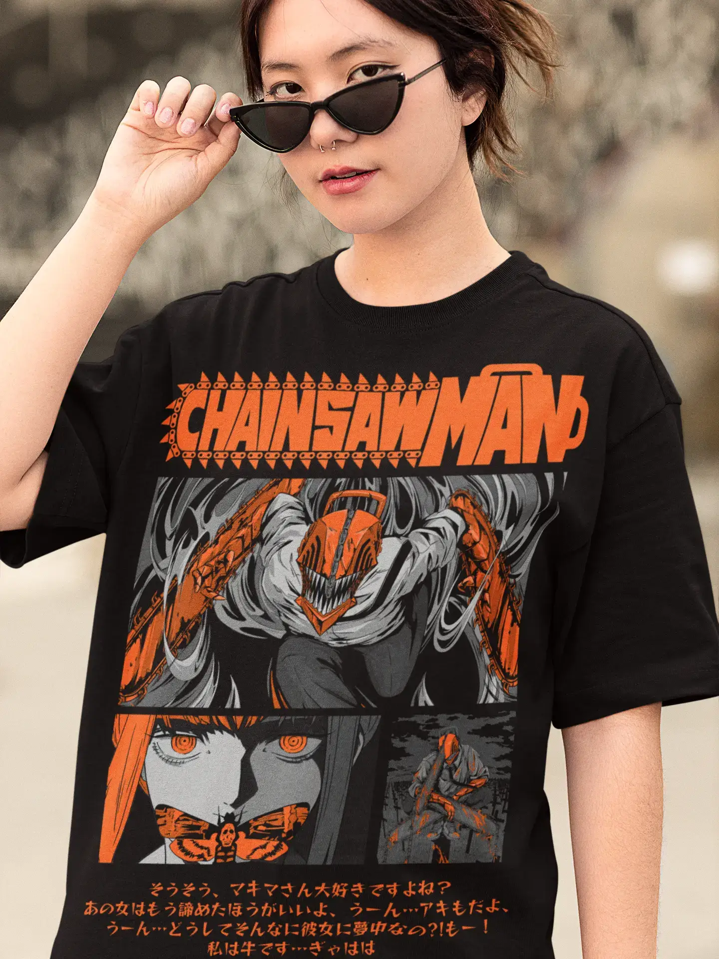 model wearing a black oversized t-shirt with 'Chainsaw Man' graphic design.